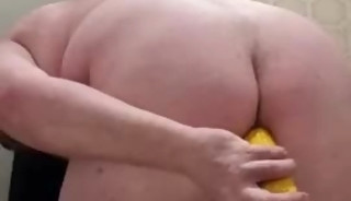 A Chubby Guy With A Corn Cob Up His Ass