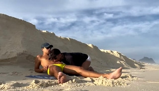 Passive twink showing his ass on the beach in front of everyone.