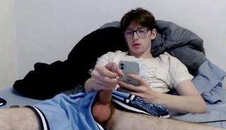 Nerdy Twink Scrolling While Stroking His Big Dick