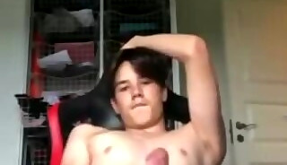 A103. Boy in red armchair on webcam