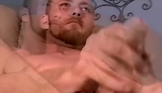 Tattooed guy jerks off his amazing and big dick with vigorous strokes