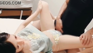 A young male college student masturbates and ejaculates with a sex doll wearing a green baby doll.