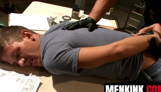 Officer Connor Maguire bounds and torments Alexander Gustavo for littering