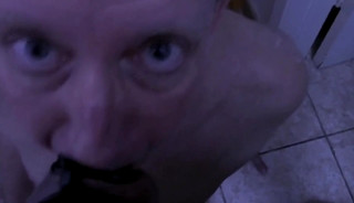 Gulping Down a Harnessed Cock