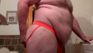 Fat Chub plays with dildo wearing a jock in his bathroom