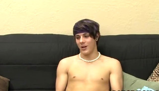 Inked twink stroking in an interview