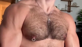 Muscled hunk sniffs own pits