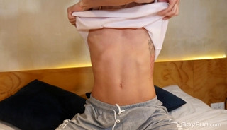 Slim, smooth twink Leo Palmer playing with his big dick
