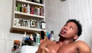 Caribbean man jerks off in bathroom