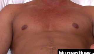 Muscular soldier Brad Banks jerks off his big cock solo with intense grip