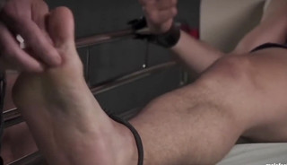 Blindfolded hunk endures tickling torment while restrained
