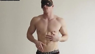 Masked amateur muscled stud solo masturbates on the couch